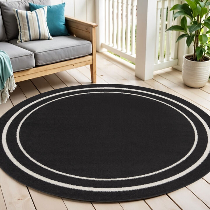 HomeRoots 4' Black And Ivory Round Indoor Outdoor Area Rug