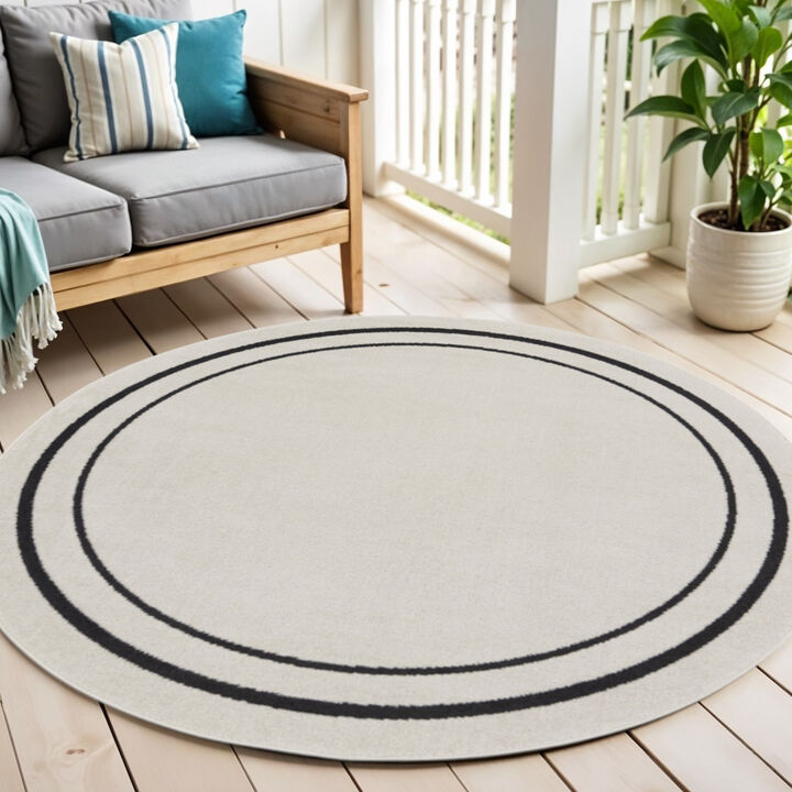 HomeRoots 4' Ivory And Black Round Indoor Outdoor Area Rug