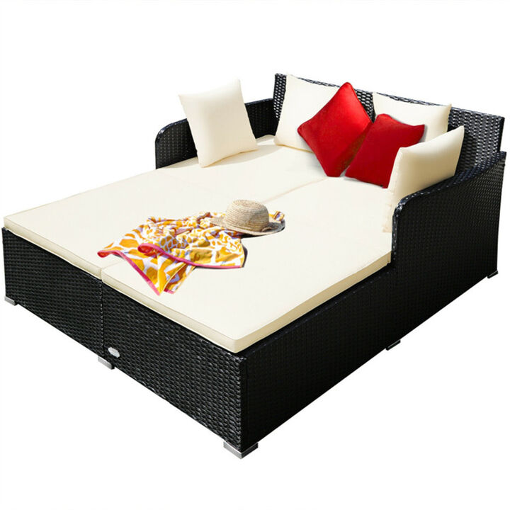 Outdoor rattan daybed with upholstered cushions - Comfortable seating for garden or patio