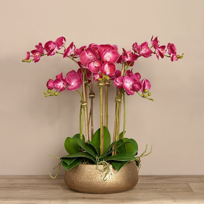 Faux pink orchid arrangement in matte gold planter