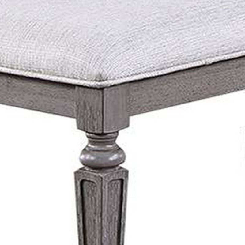 Winie Dining Bench with Turned Legs, 64 Inch Gray Wood and Fabric - Benzara