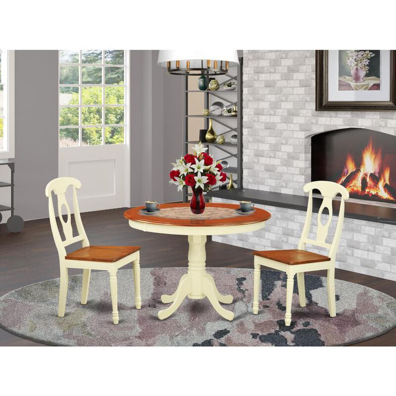 3 Pc set with a Round Kitchen Table and 2 Wood Dinette Chairs in Buttermilk and Cherry .