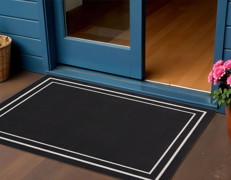 HomeRoots 2' X 4' Black And Ivory Indoor Outdoor Area Rug image number 1