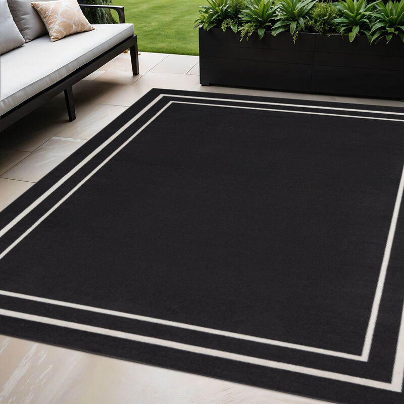 HomeRoots 5' X 7' Black And Ivory Indoor Outdoor Area Rug image number 1