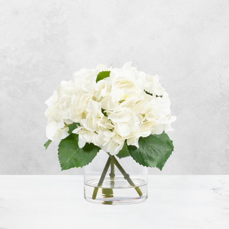 White hydrangeas centerpiece arrangement in vase